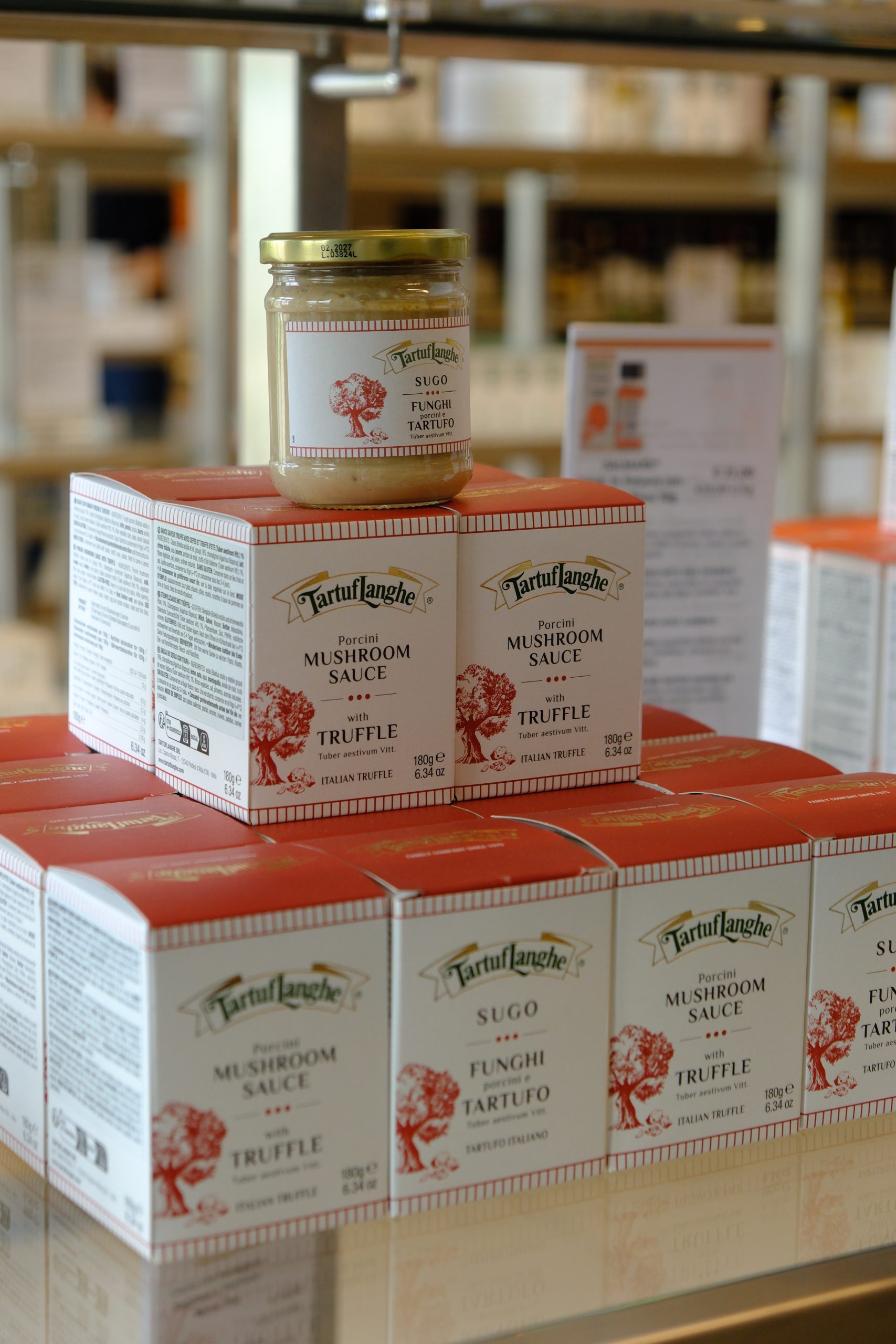 TartufLanghe jars and boxed specialties arranged in the company showroom.