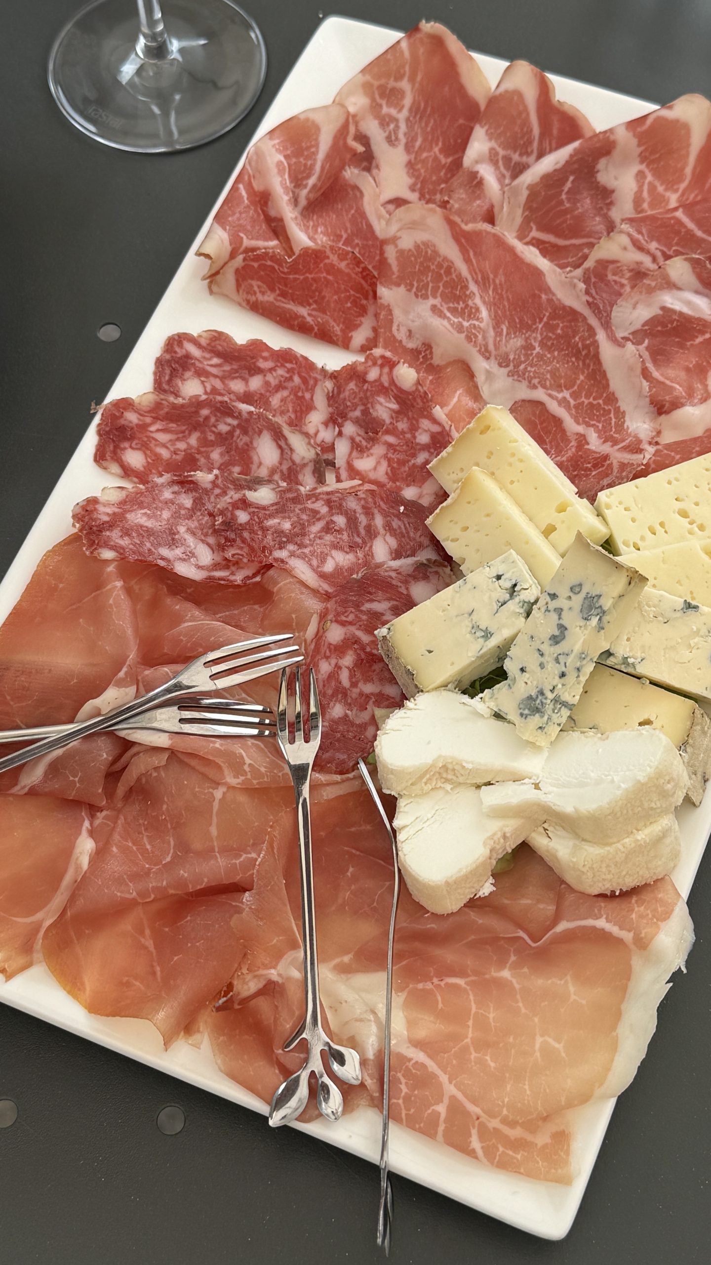 Selection of regional cured meats and Piedmont cheeses arranged for a tasting in the Langhe.