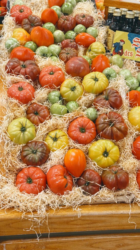 Colorful heirloom tomatoes displayed at a market in Maisons-Laffitte, France.