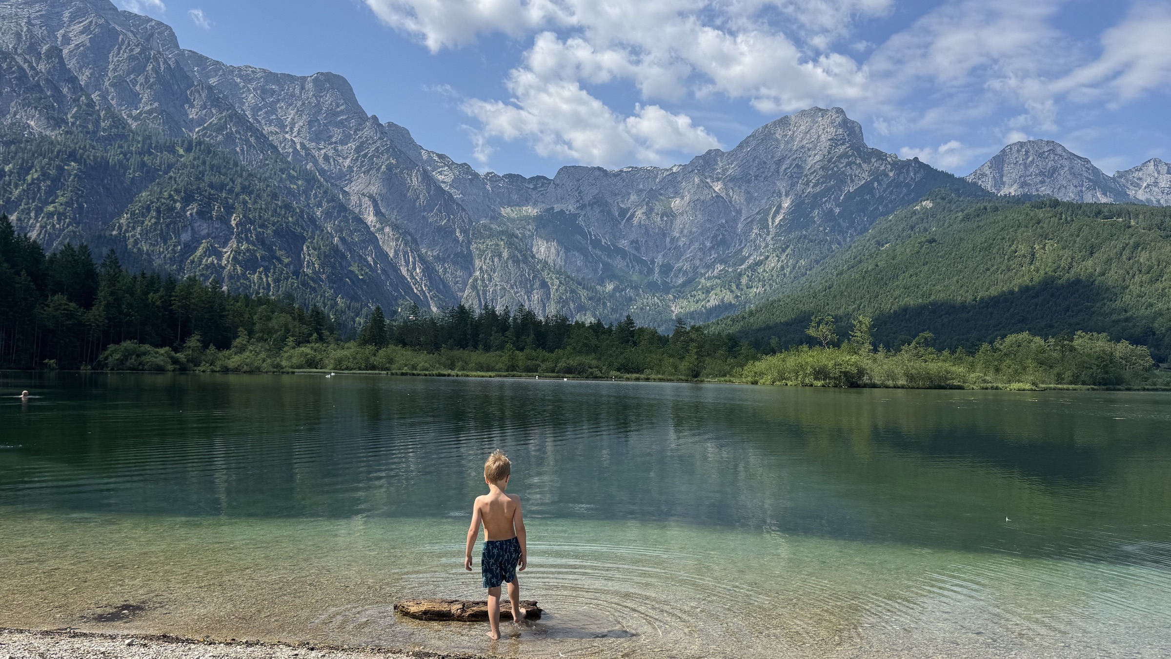 A quiet family moment at the clear mountain shore of Almsee.