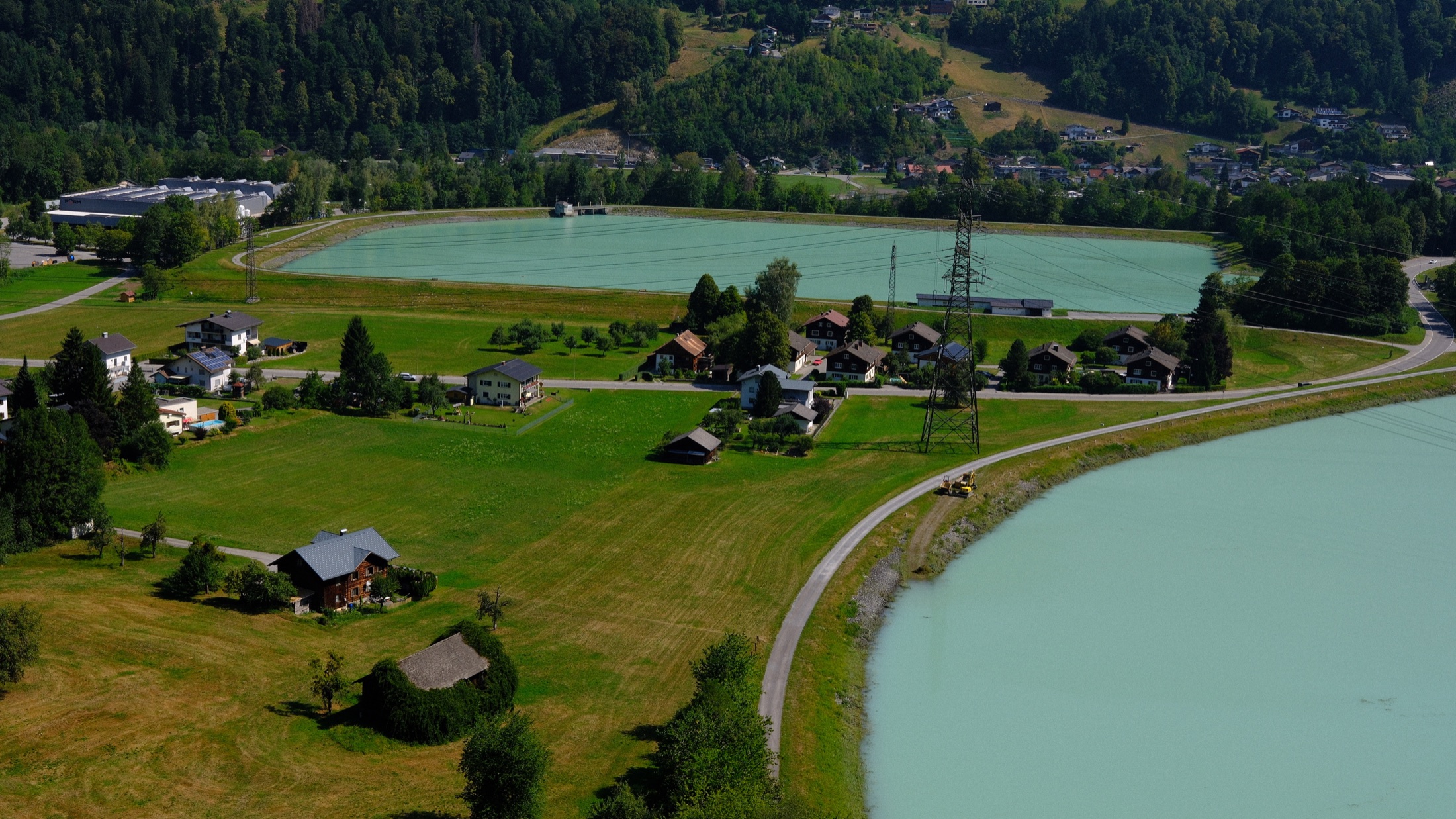 The pale green Latschau reservoir seen from Golm mountain