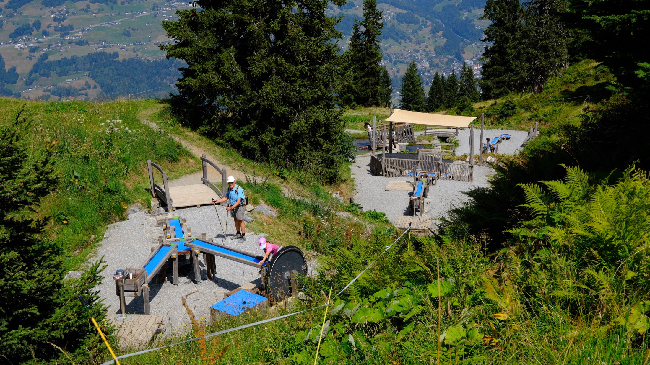 Play equipment and activity structures beside the Golm trail