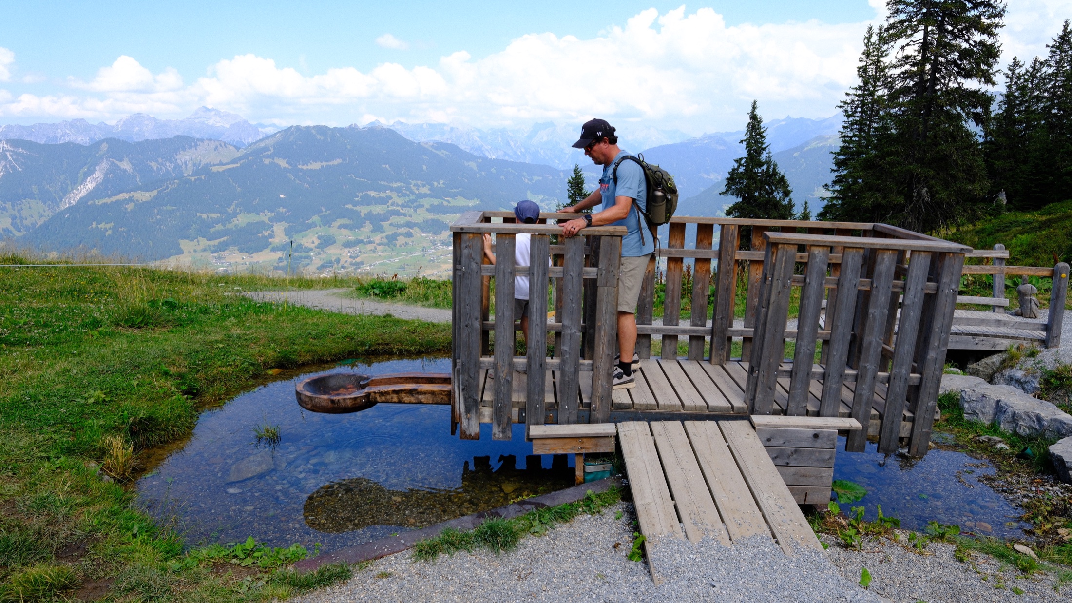 A wooden water activity station overlooking the valley