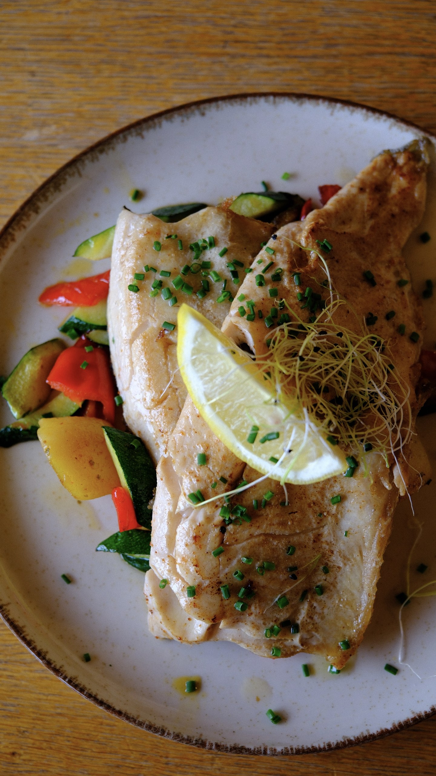 Trout fillets with lemon, potatoes, courgette and red pepper at the Douglass Hütte.
