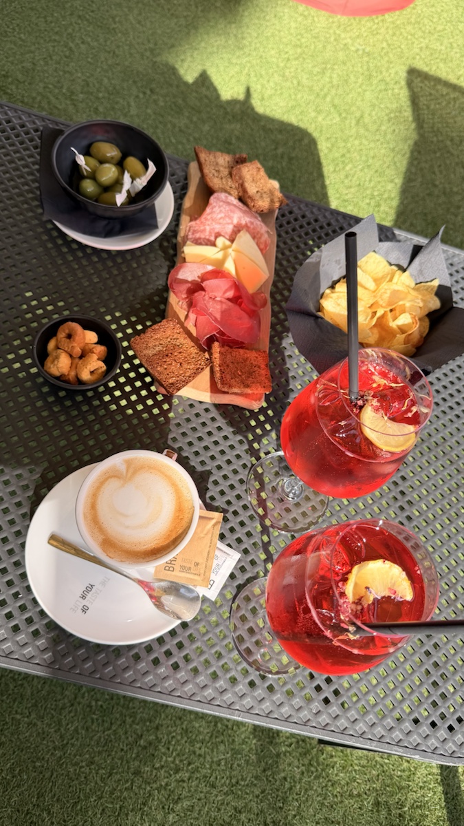 Spritz drinks served with cheese, cured meats, olives and snacks